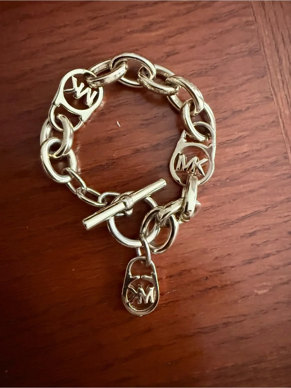 Michael Kors Gold Tone MK Logo Toggle Charm Bracelet